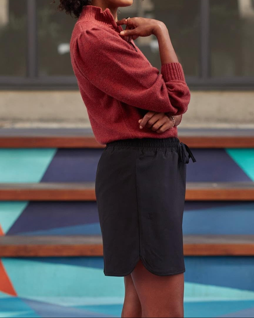 Close-up of black skort with dolphin hem and elastic waist