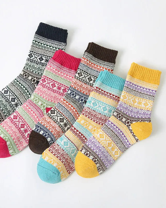 Set of colorful patterned socks on a white background