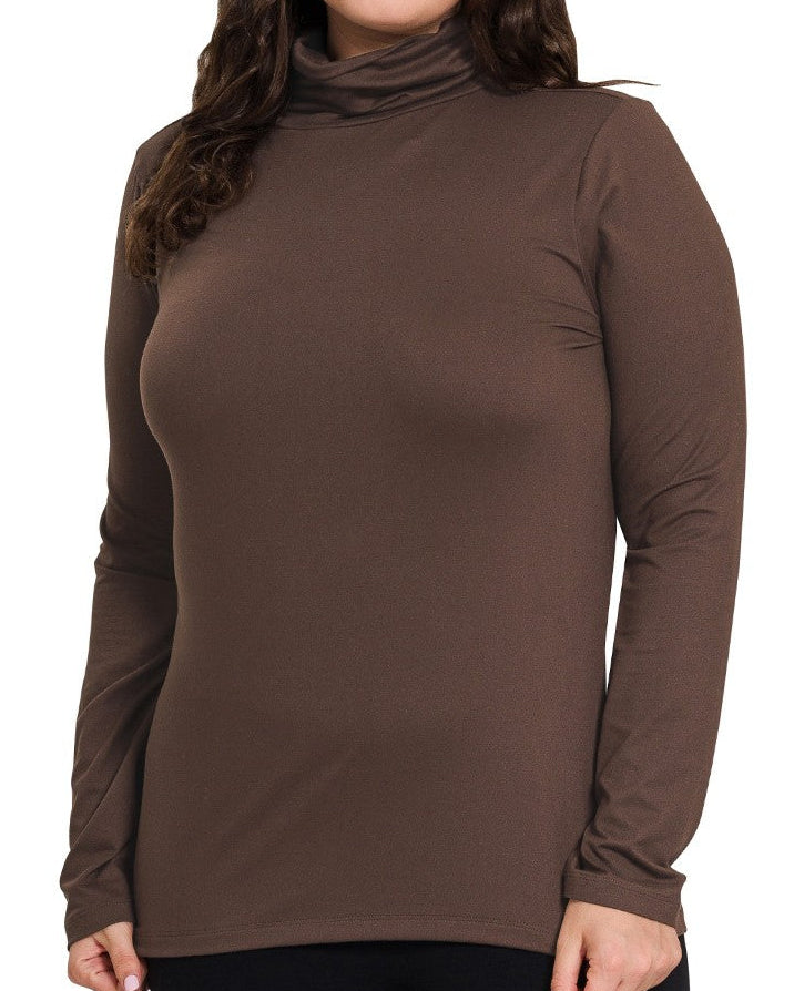 Woman wearing a brown long-sleeve top on a white background
