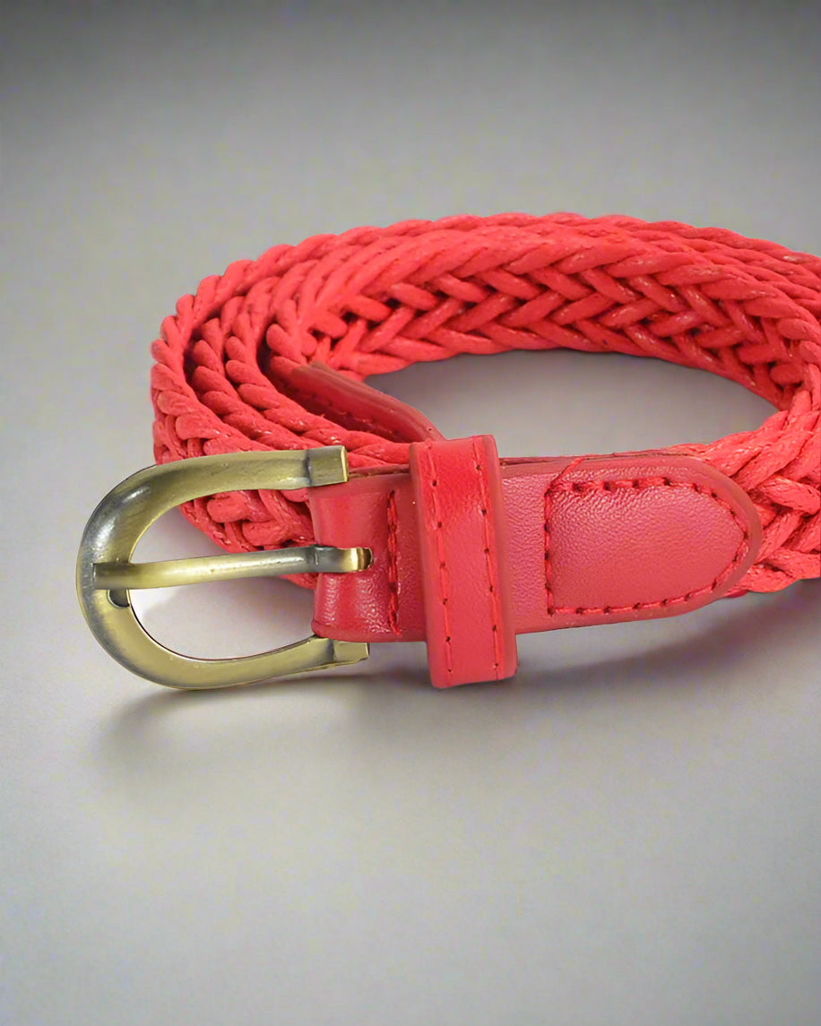 red belt with vintage buckle on table rolled
