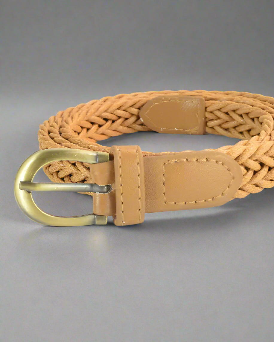 tan belt rolled on table