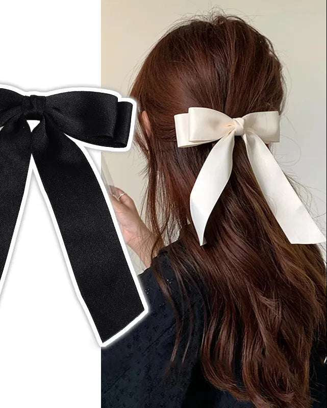 Woman wearing satin bow in half-up hairstyle