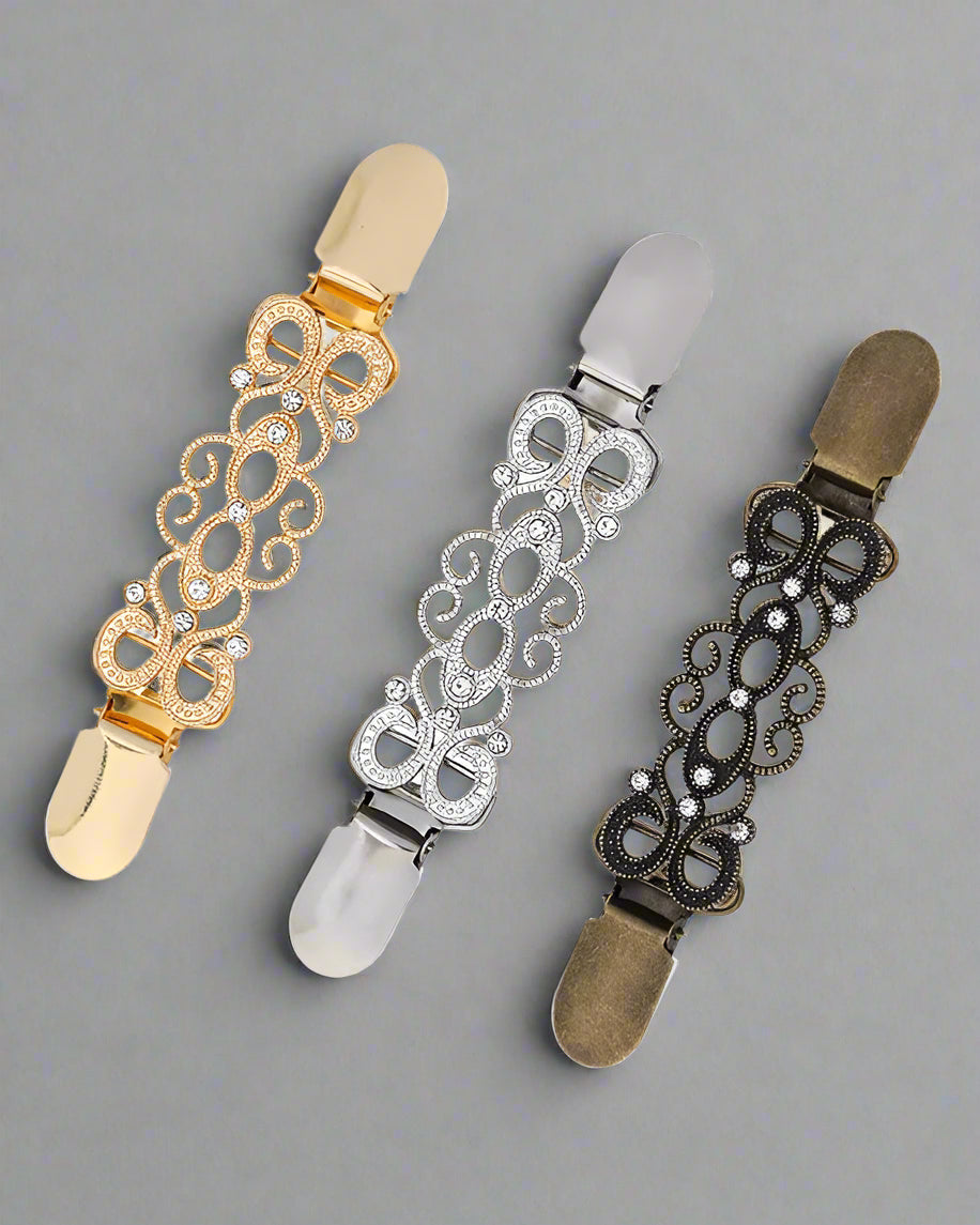 Silver rhinestone scarf clasp with vintage-inspired swirls