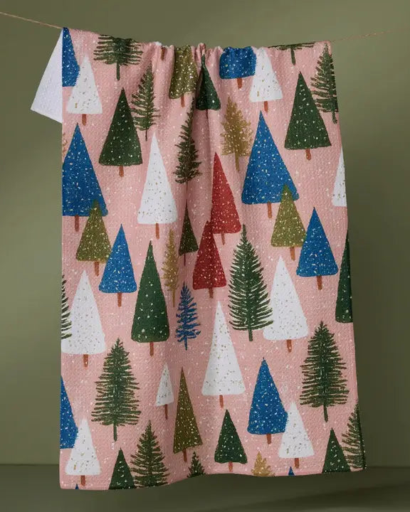 Festive towel with colorful Christmas tree pattern on a green background