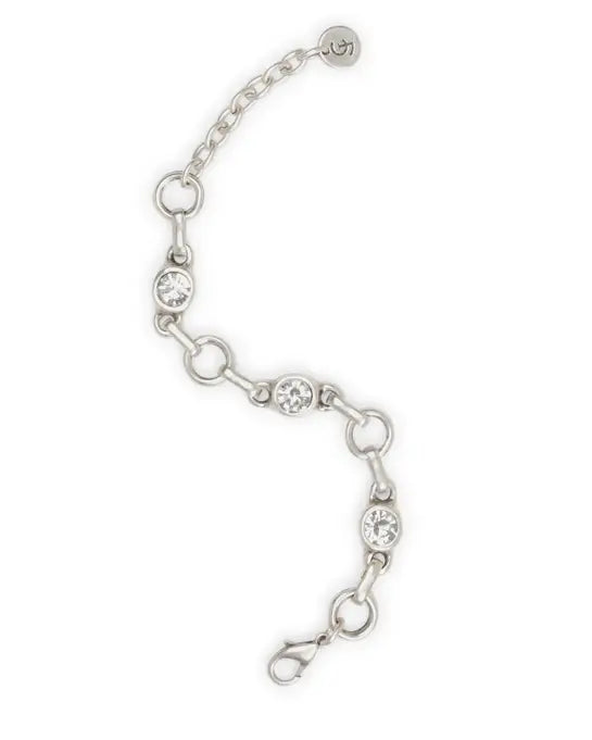 Silver bracelet with clear crystals on a white background