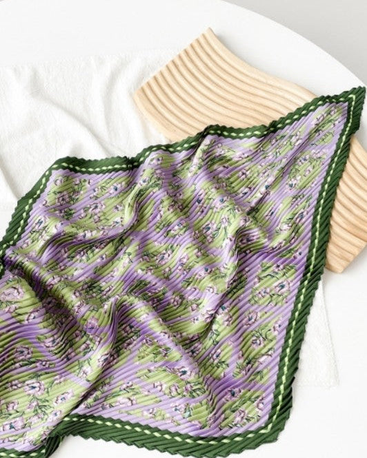 Purple and green patterned fabric on a white plate