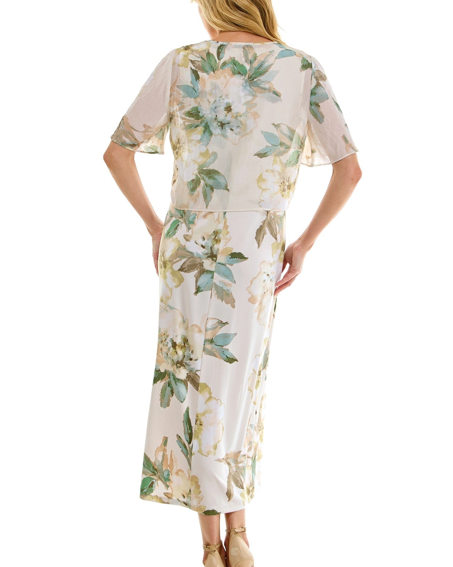 Woman wearing a floral dress on a white background