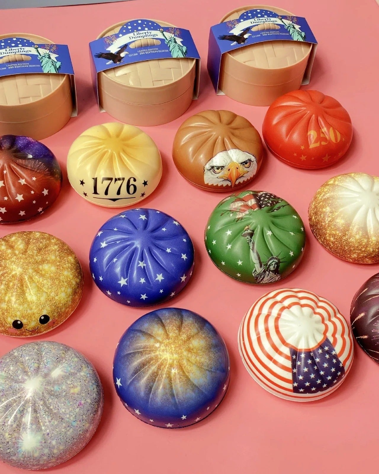 Assorted decorative buttons with various designs on a pink surface