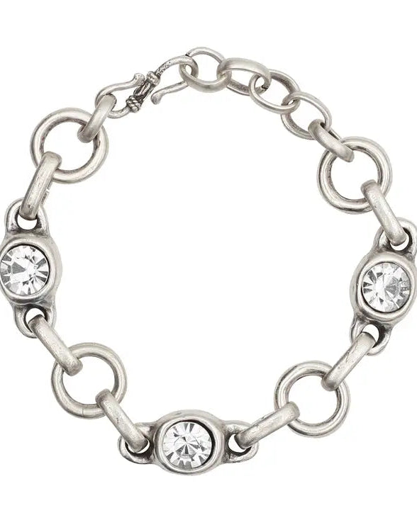 Silver chain bracelet with embedded crystals on a white background