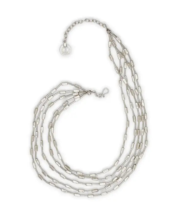 Silver beaded necklace on a white background