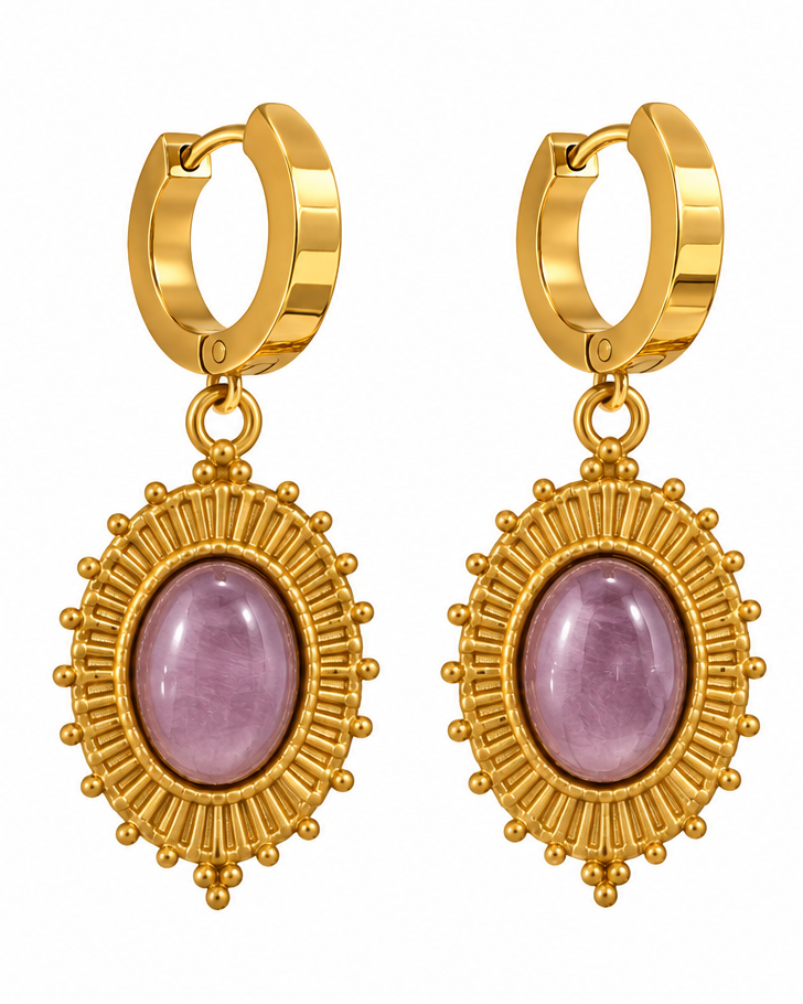 Gold hoop drop earrings with oval lavender-purple cabochon stones, shown on a white background and worn on a model's ear.