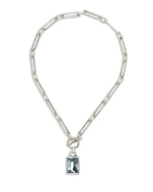 Silver chain necklace with a pendant on a white background