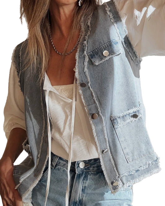 Person wearing a light blue denim vest over a beige top and jeans.