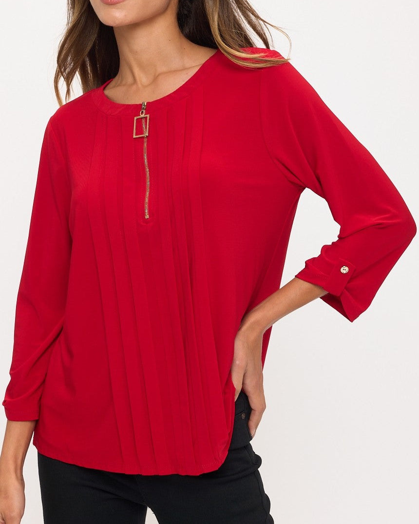 Woman wearing a red blouse with a white background