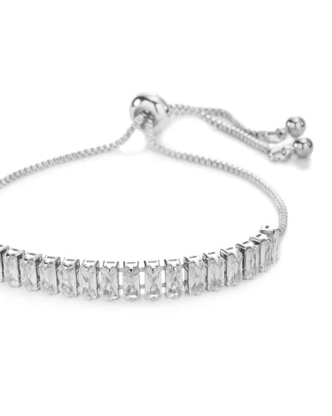 Silver bracelet with clear gemstones on a white background