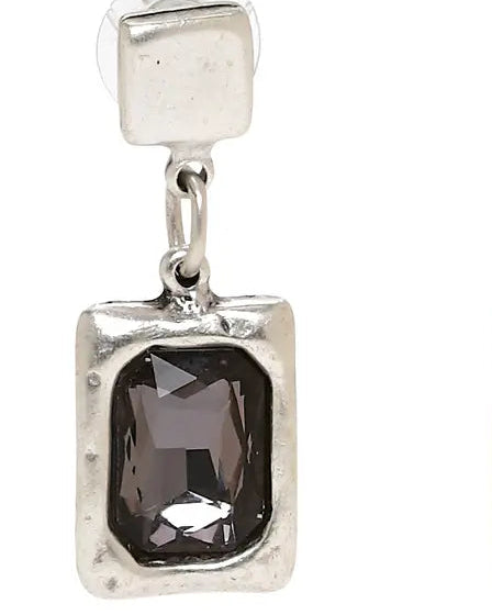 Silver earrings with smoky gemstones on a white background