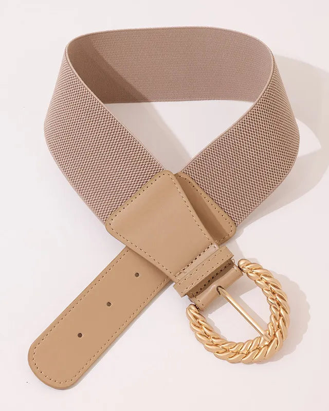 Beige belt with a gold braided buckle on a light beige background