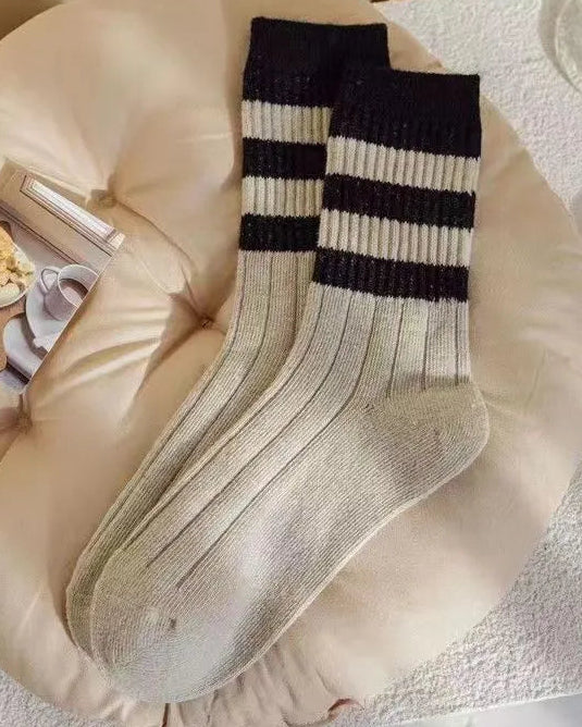 Striped socks on a soft surface with a blurred background