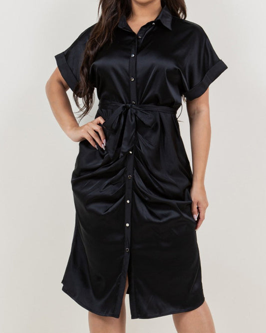 Woman wearing a black dress with a white background