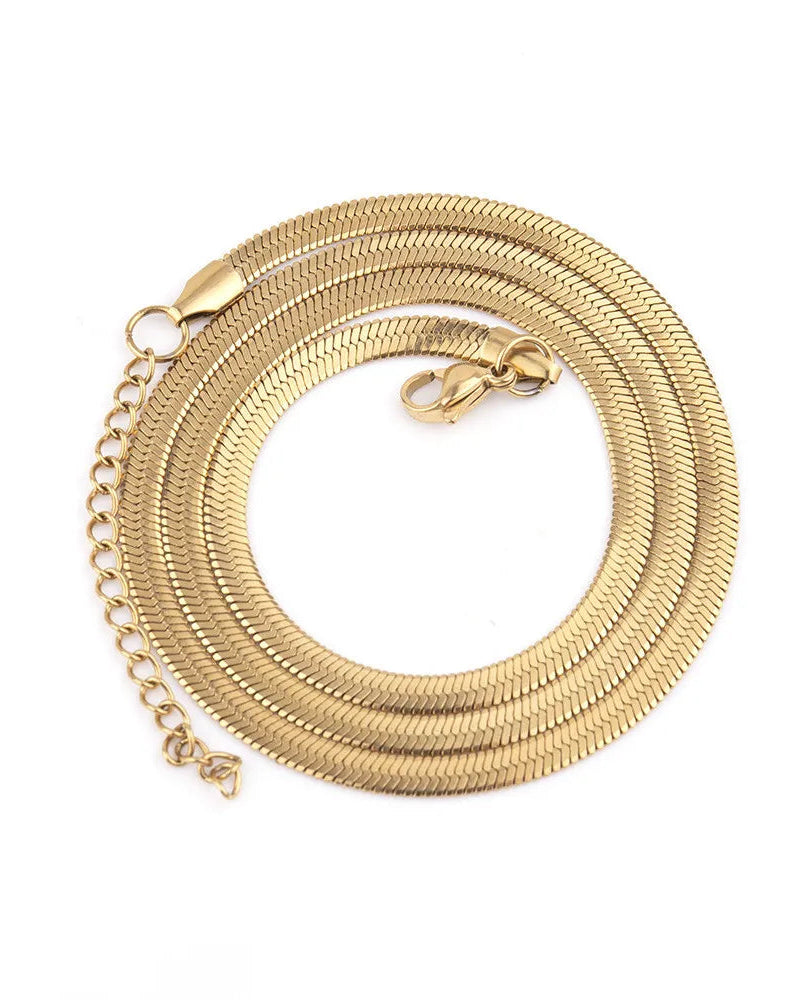 Gold chain necklace on a white background