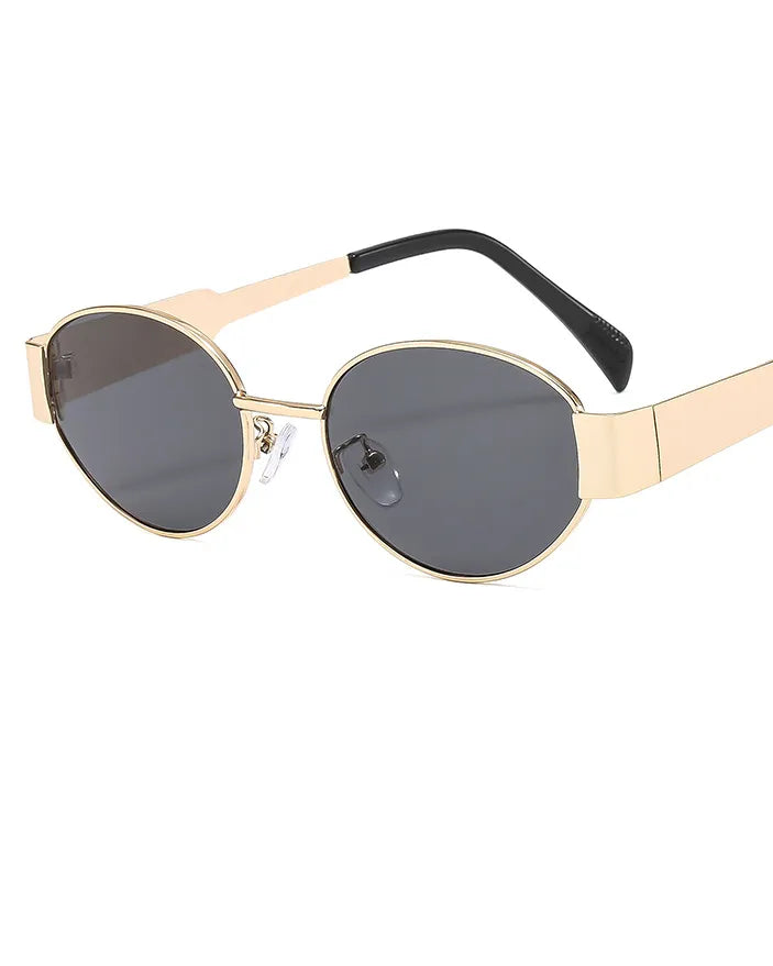 Gold-framed sunglasses with black arms on a white background