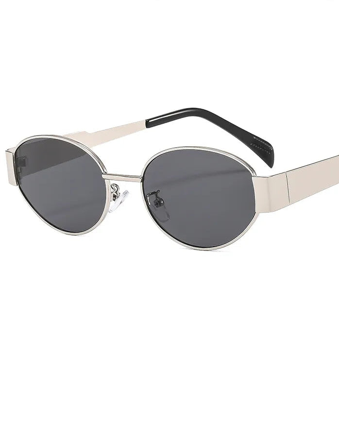 Sunglasses with metallic frame and dark lenses on a white background