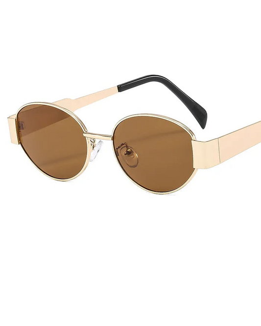 Sunglasses with gold frame and brown lenses on a white background