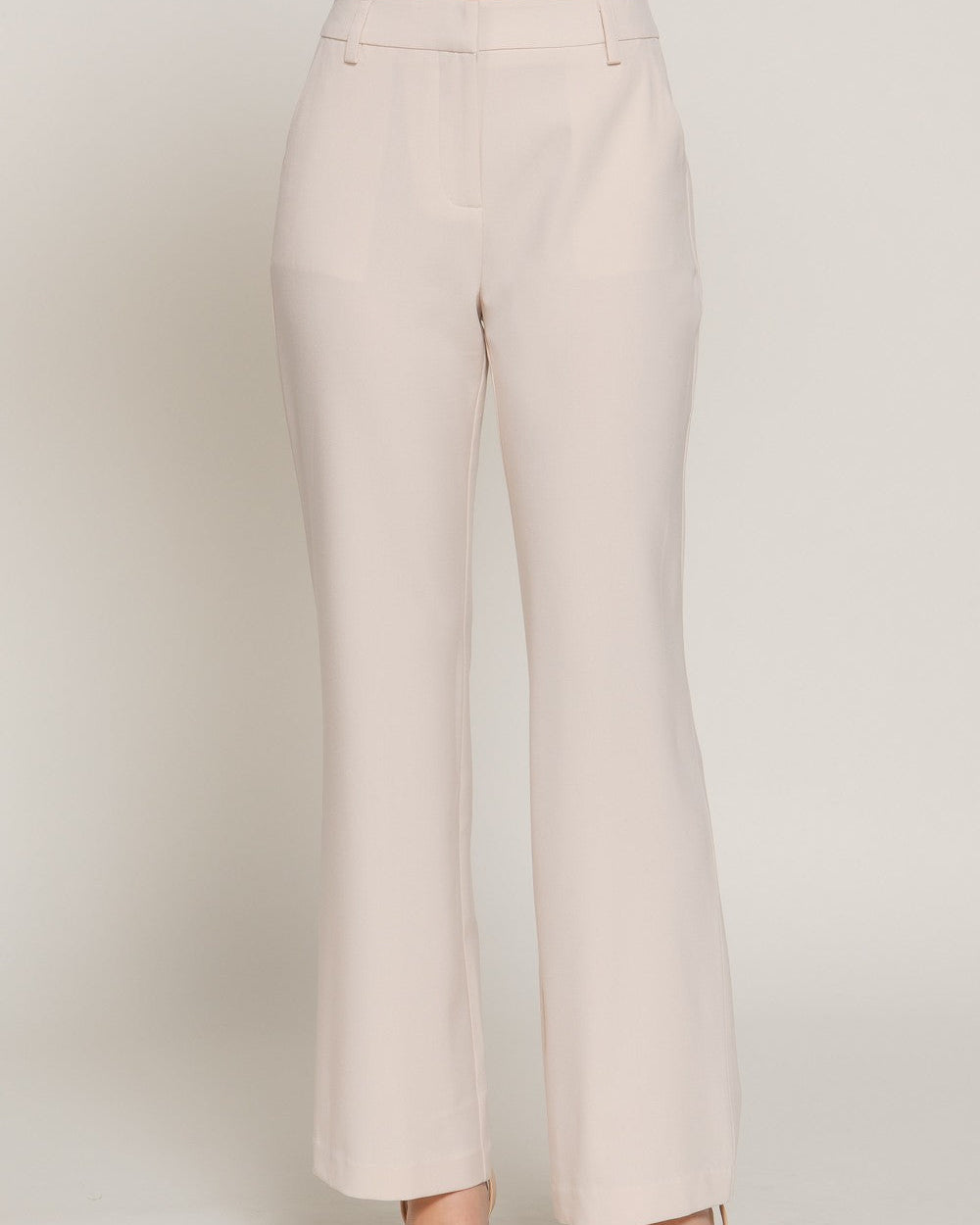 Beige pants on a plain background