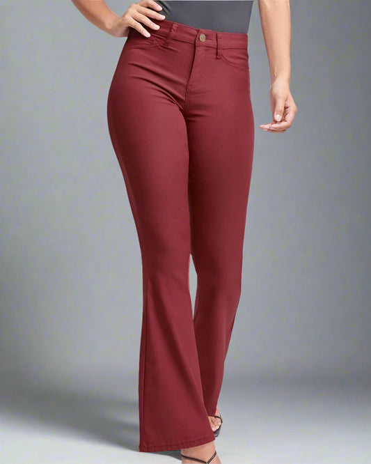 Woman wearing dark rose flare pants and a black bodysuit, front view