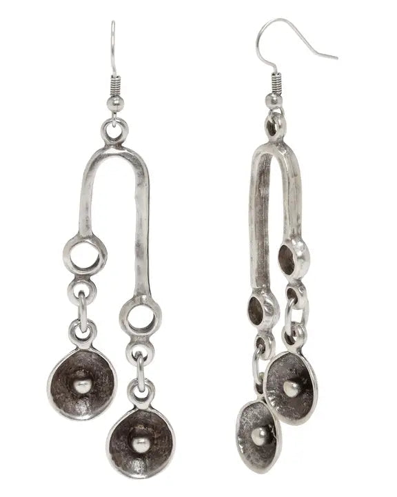 Pair of silver earrings with circular designs on a white background