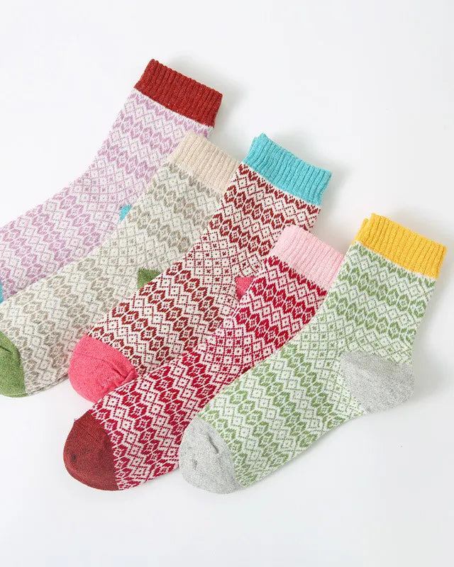 Set of colorful patterned socks on a white background