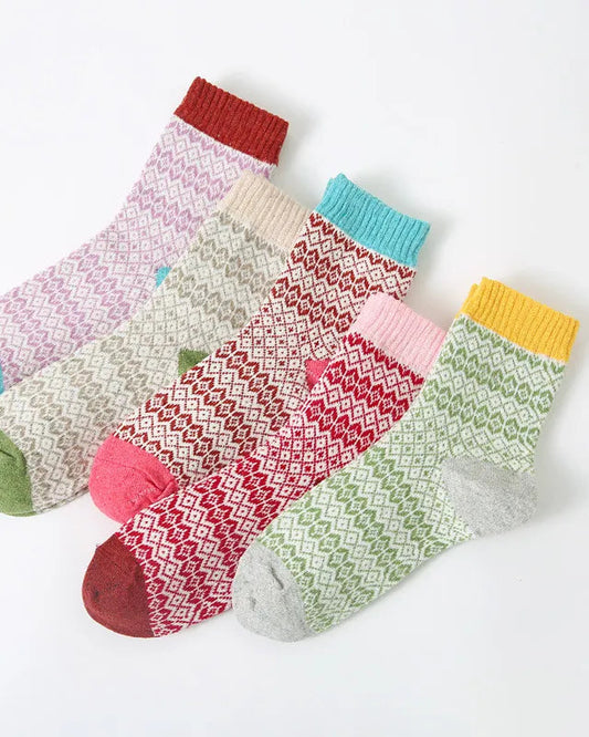 Set of colorful patterned socks on a white background