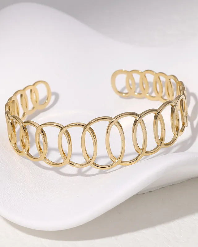 Gold bracelet on a white background