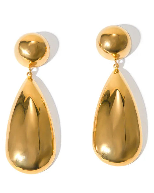 Gold teardrop earrings on a white background