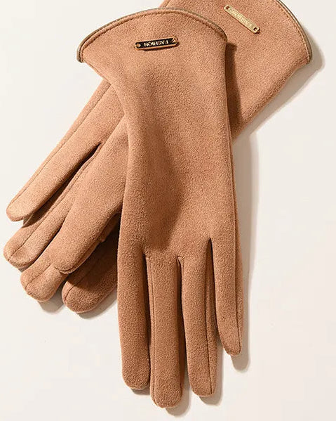 Pair of brown gloves with a visible brand logo on a light beige background
