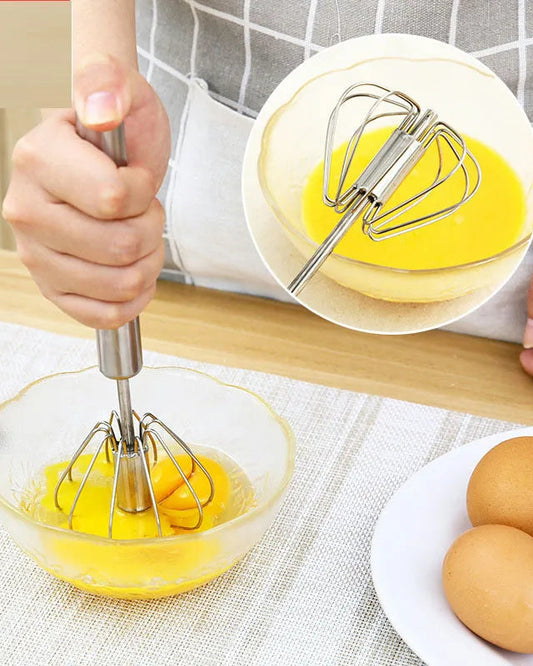 Detail/Alternate Image: Close-up of whisk mixing eggs in a clear glass bowl