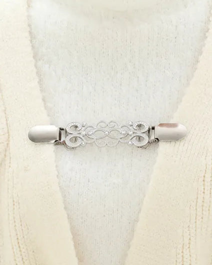 Silver version worn on a white cardigan