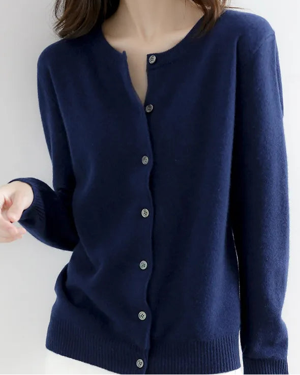 Navy blue cardigan worn by a person on a white background