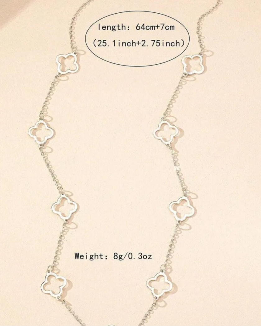 Necklace with clover-shaped links on a beige background