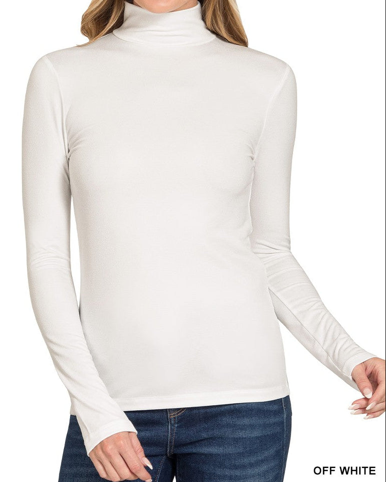 Woman wearing an off-white turtleneck sweater on a white background