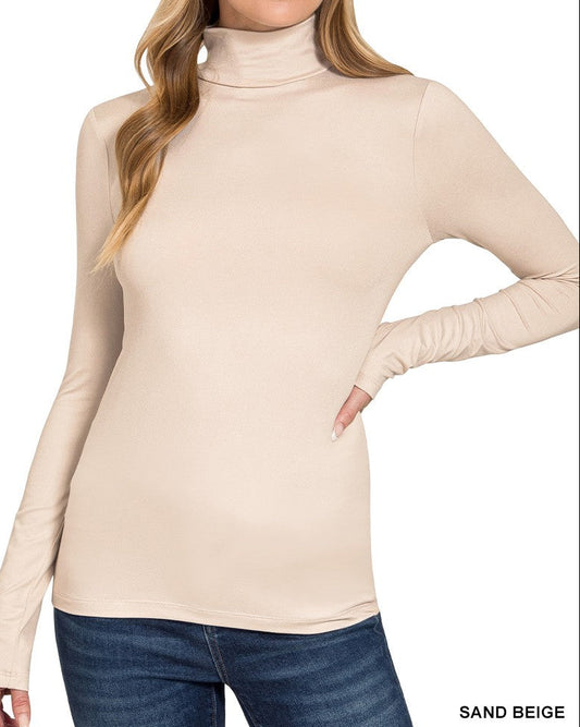 Woman wearing a sand beige turtleneck sweater on a white background