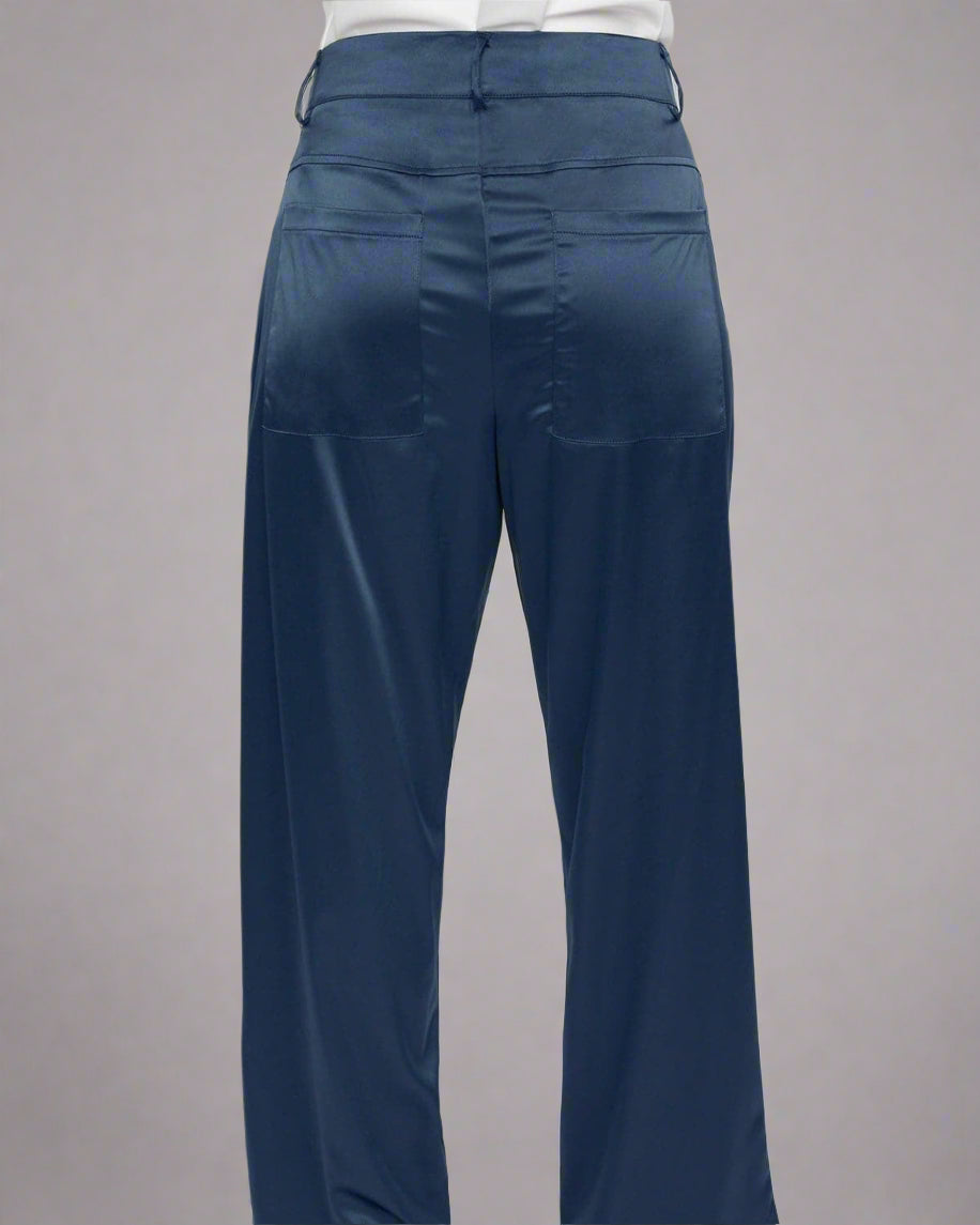 Navy blue pants worn by a person on a white background