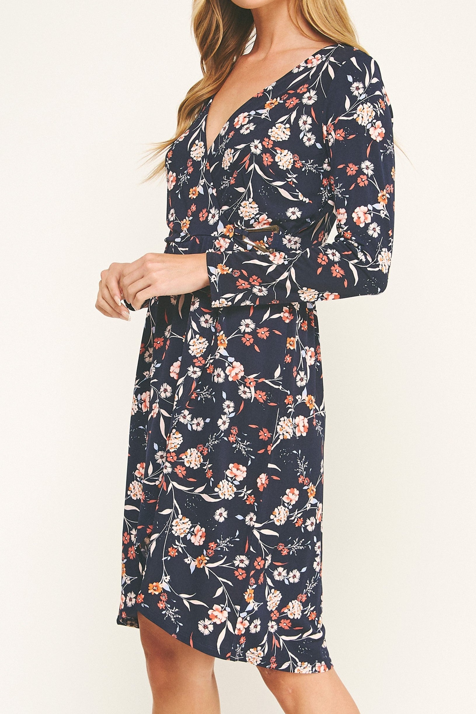Woman wearing a floral dress on a white background