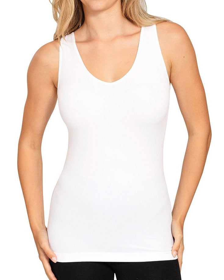 Woman wearing a white tank top on a white background