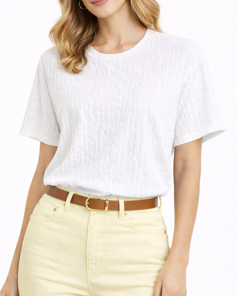 Woman wearing a white top and yellow shorts on a white background